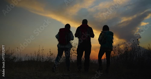 Three mexican friends walks to the Popocatepetl at sunset