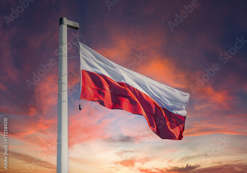 National state flag of Poland and stormy sunset sky photo