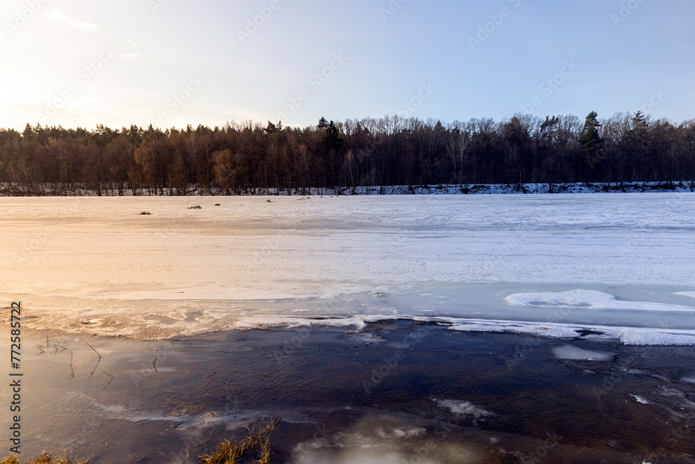 the ice-covered surface of the river in the winter season the ice-covered surface of the river in the winter season