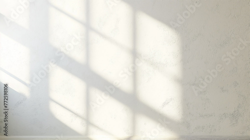 White interior wall texture with shadow of window panes cast onto surface A window pattern projected onto a plain  flat white wall.