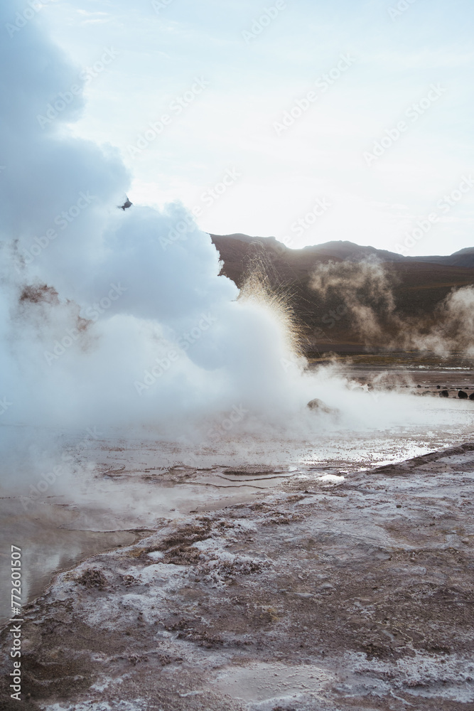 Dense column of smoke during sunrise in Tatio geysers in the Atacama desert, Chile Dense column of smoke during sunrise in Tatio geysers in the Atacama desert, Chile