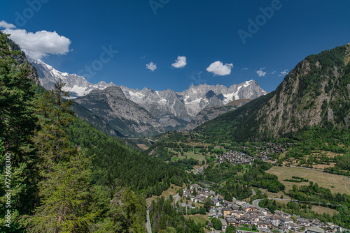 Aerial view of a mountain village in Aosta Valley with scenic view of Mont Blanc chain