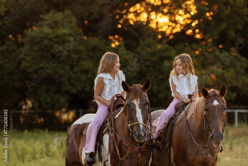 Little Girls with Horses riding western quarter horse and paint horse cowgirls in pink having fun © Terri Cage 