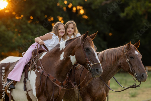 Little Girls with Horses riding western quarter horse and paint horse cowgirls in pink having fun