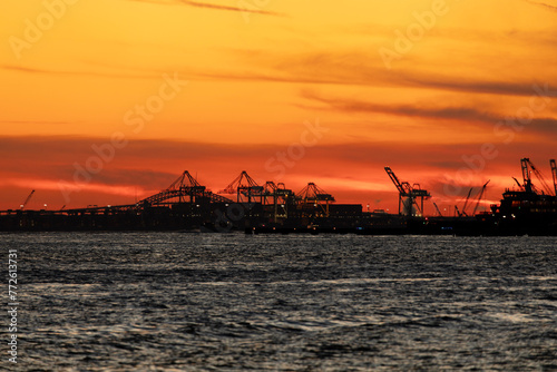 Commercial dock gantry cranes at sunset