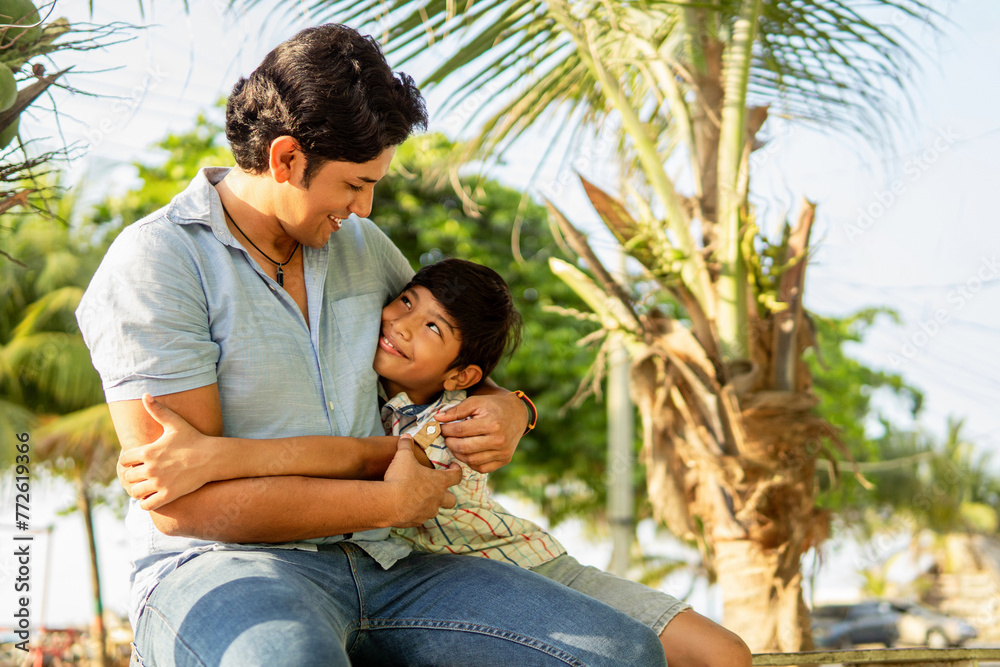 Loving Father Embracing Son in a Tender Moment Outdoors