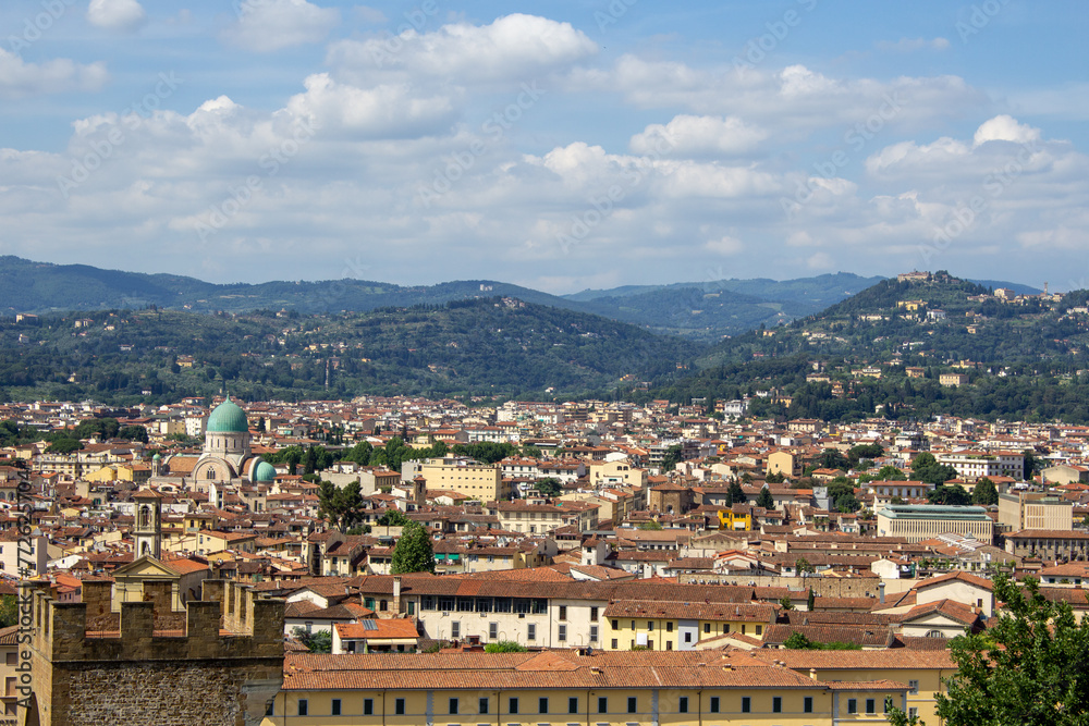 Florence's sprawling cityscape set against the serene Tuscan hills, highlighting the fusion of urban life and nature.