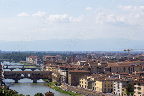 Panoramic view of Florence with the Arno River and multiple bridges, encapsulating the essence of this historic Italian city.