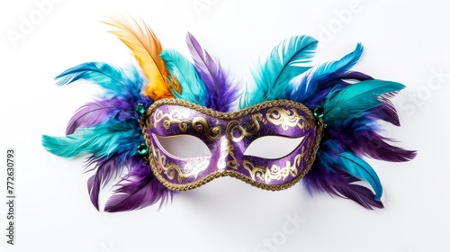A purple and blue mask with gold and green feathers