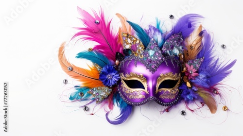 A colorful mask with feathers and jewels on it