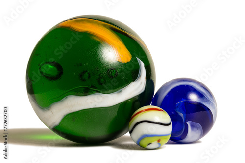 Three Colorful Glass Marbles In Three sizes.