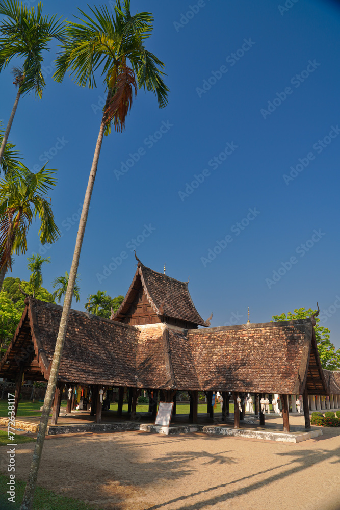 the beautiful ancient building temple and sugar palm tree with blue sky is travel landmark in Chiangmai thailand the beautiful ancient building temple and sugar palm tree with blue sky is travel landmark in Chiangmai thailand