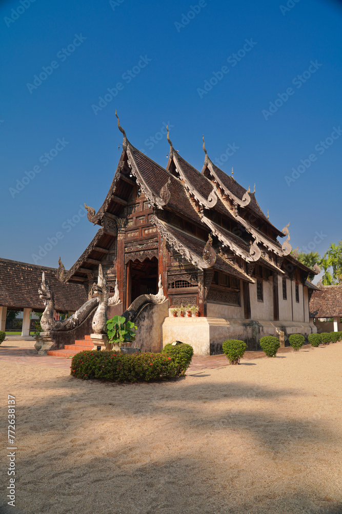 the beautiful ancient building temple and sugar palm tree with blue sky is travel landmark in Chiangmai thailand the beautiful ancient building temple and sugar palm tree with blue sky is travel landmark in Chiangmai thailand