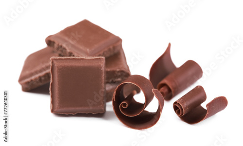 Delicious chocolate shavings and pieces isolated on white