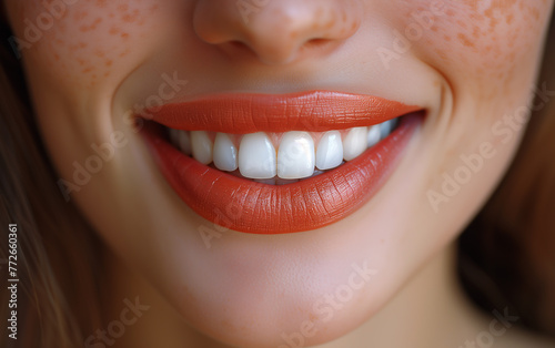 close up of a woman smiling and showing her perfect teeth. Concept for oral care  dentistry  and stomatology. 