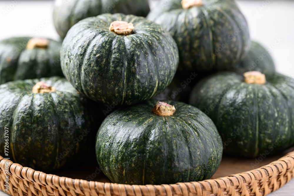 Green pumpkin or Japanese pumpkin in natural basket, Vegetable in autumn season Green pumpkin or Japanese pumpkin in natural basket, Vegetable in autumn season