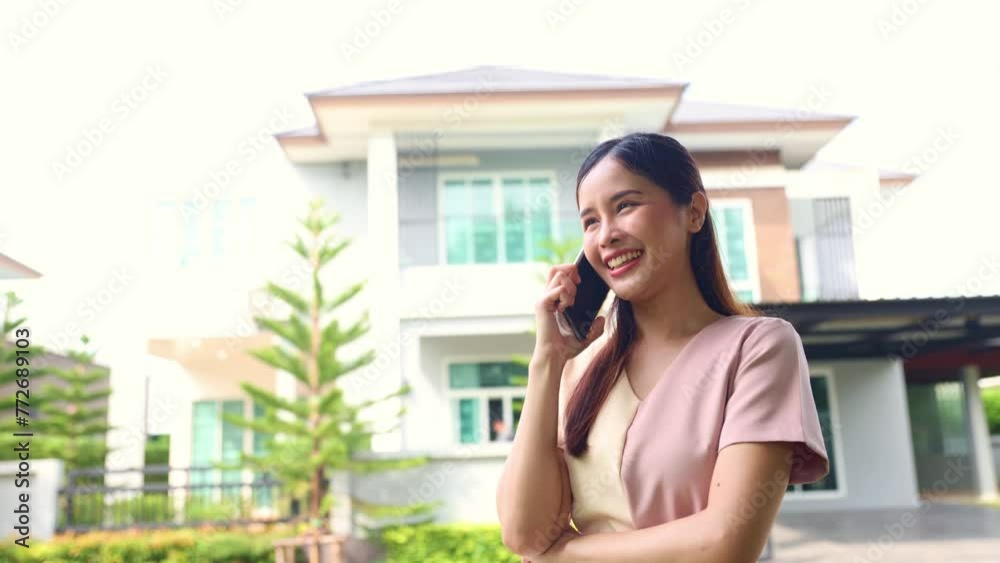 Happy, beautiful asian business woman talk to a loan officer succeeds in getting home loan from bank with high loan amount and low interest and is ready money to buy house and decorate the interior.