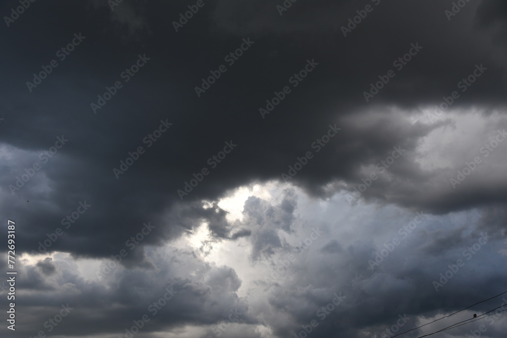 Dramatic dark storm thundercloud rain clouds on black sky background. Dark thunderstorm clouds rainny landscape. Meteorology danger windstorm disaster climate. Dark cloudscape storm disaster gray sky