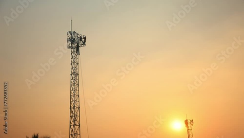 Silhouette Teamwork of male workers constructing telecom pole high tower large work site new construction built according to the economic changes the development of modern 5G communications. photo