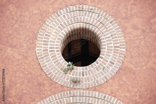 wall with window circle brick church
