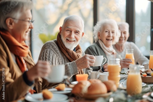 Reunion of old friends eating together while chatting and laughing