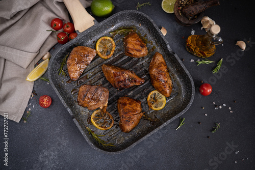 grilled pieces of Organic Tuna Steak on a grill frying pan © Anatoly Repin