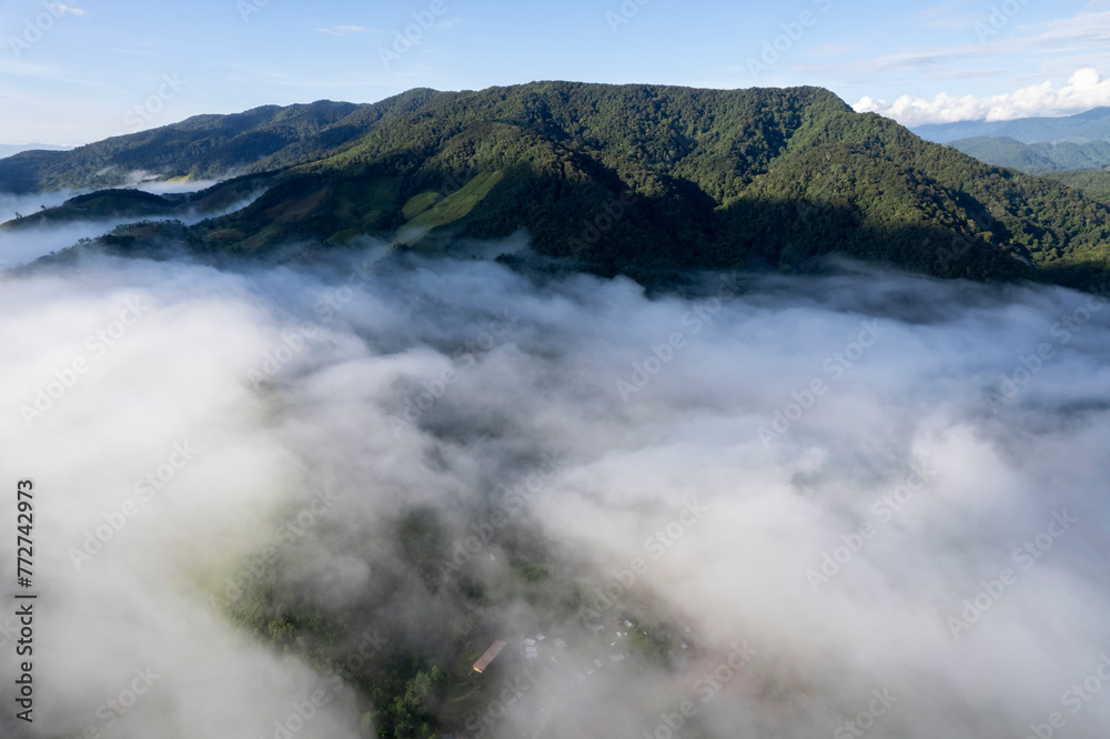 Landscape of Morning Mist with Mountain Layer at north of Thailand. mountain ridge and clouds in rural jungle bush fores