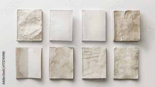 A set of blank paperback books with crumpled and wrinkled covers, evoking a blank label concept, organized symmetrically