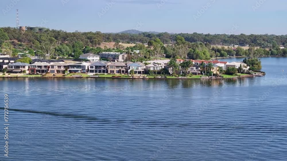Aerial over Lake Mulwala and revealing the resort houses on the shoreline Aerial over Lake Mulwala and revealing the resort houses on the shoreline