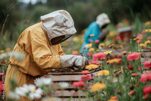 A beekeeper in protective gear tending to beehives amidst blooming flowers