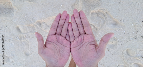 wrinkles on boy's fingers after swimming in the sea. A boy's hands aftet playing water. The fingers are wet and a little bit wrinkle photo