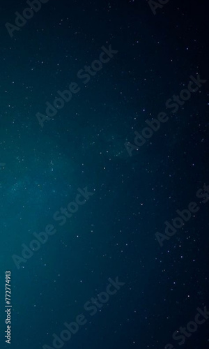 dark blue sky with stars and a bright green light