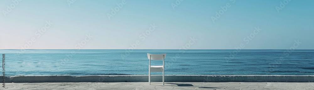 In a minimalist setting, a solitary chair faces the ocean, its serene view a testament to the tranquility of simplicity. In a minimalist setting, a solitary chair faces the ocean, its serene view a testament to the tranquility of simplicity.