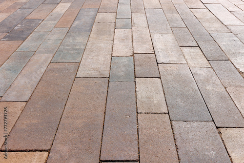 Paving slabs of rectangular elongated shape of different sizes and colors. Angled view.