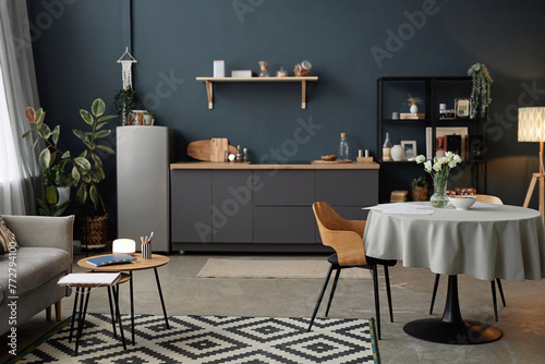 No people shot of part of modern apartment interior in gray and gray-blue colors with minimalistic furniture