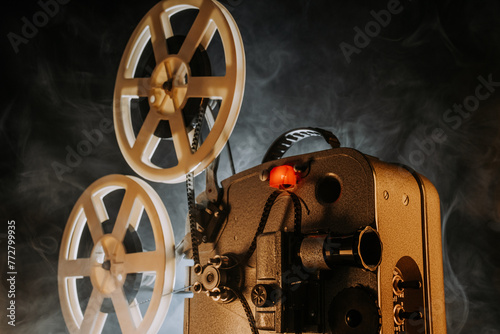 Obsolete film projector, retro home theatre entertainment. Nostalgia, memories