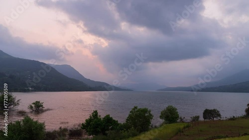 Timelapse of a sunset over a lake with amazing colour explosion with clouds moving. Perfect for your creative projects involving outdoor content. Shot in 4K ultra HD in 60fps for the smoothest video e