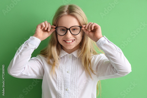 Cute little schoolgirl in e...