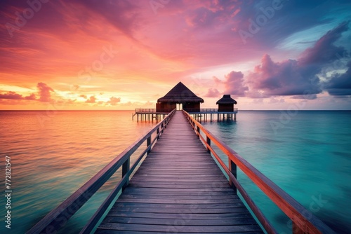 Wooden jetty at sunset in tropical island with water bungalows An amazing sunset landscape Picturesque summer sunset , Ai generated