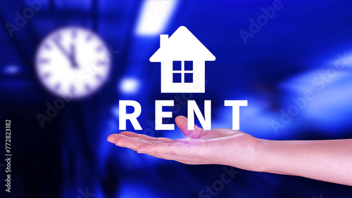 Realtor s hand puts with icon house and word RENT. Concept of renting housing  apartment  real estate. market of immobility  Property investment and house mortgage financial concept