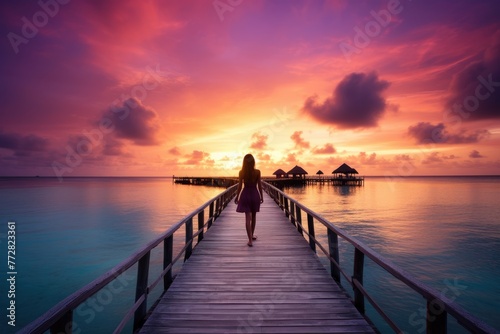 Wooden jetty at sunset in tropical  island with water bungalows An amazing sunset landscape Picturesque summer sunset , Ai generated © Tanu