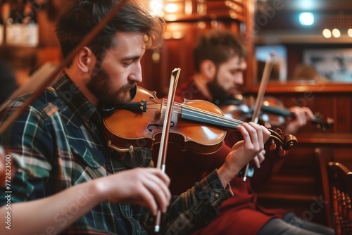 traditional musicians playing fiddles in the pub