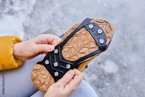 Rubber pads, anti-icing spikes for boots, are worn on trekking winter shoes to protect against slipping during icy conditions.