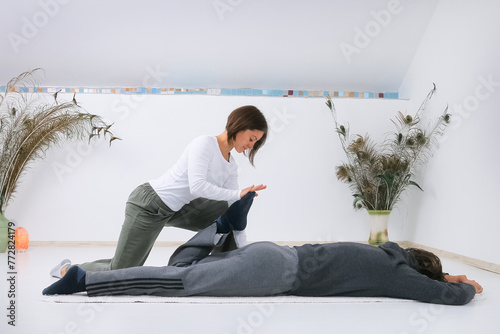 Man getting Shiatsu massage from Shiatsu masseuse