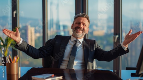 Man spreading arms in an office setting photo