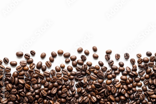 Roasted coffee beans are scattered to form an elegant border on a white background