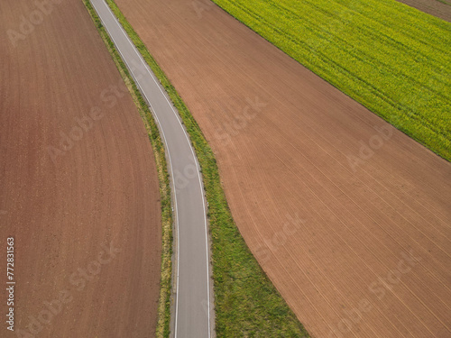 View from above of a road between countryfields in the countryside 
