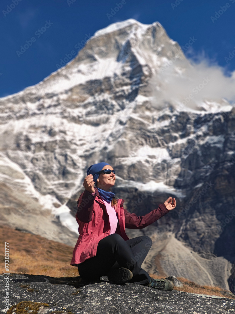 Hiking woman in sunglasses in mountains