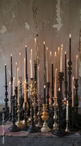 Variety of candles on elegant candlesticks