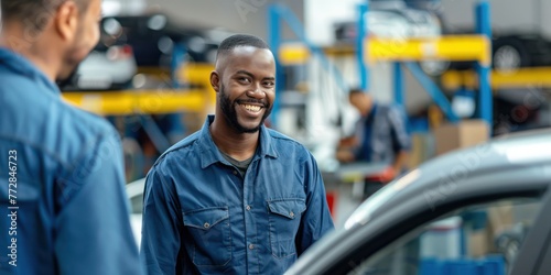 Portrait Shot of a Handsome Mechanic Working on a Vehicle in a Car Service.